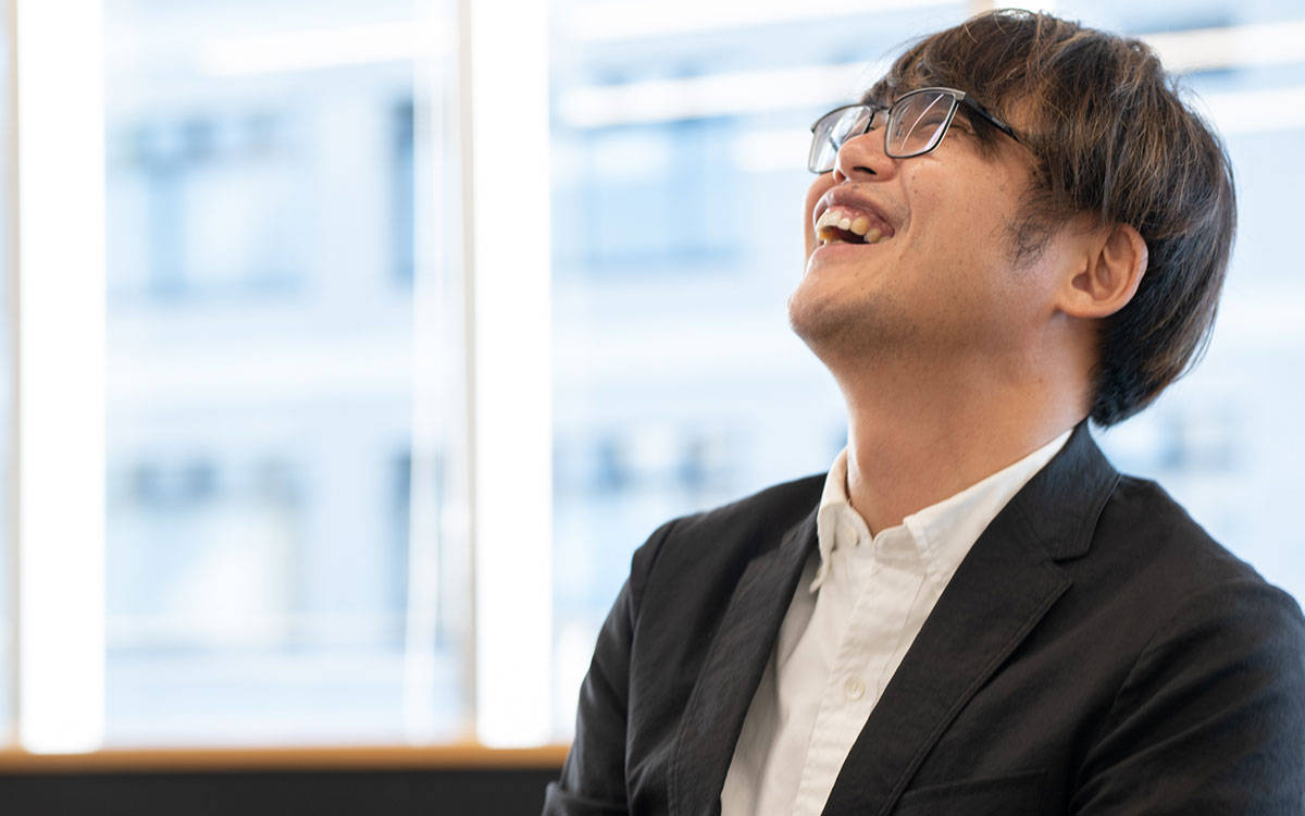 笑う田中さん